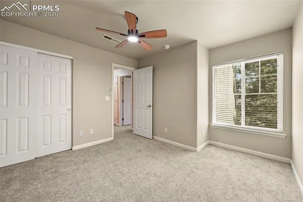 a view of an empty room with a window