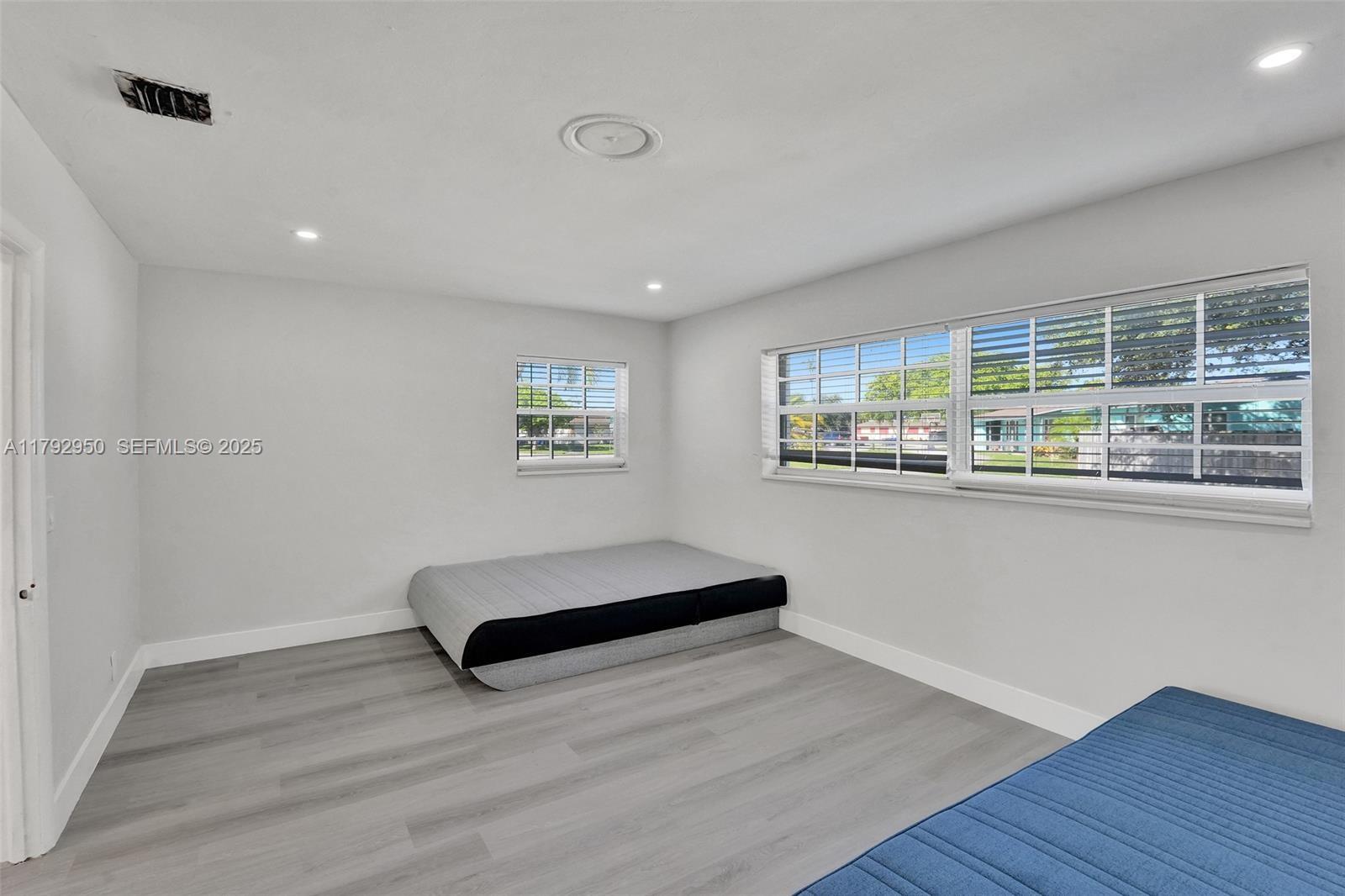 5657 Grant Street Hollywood, FL 33021 - Photo 12 of 59 a living room with furniture and a large window