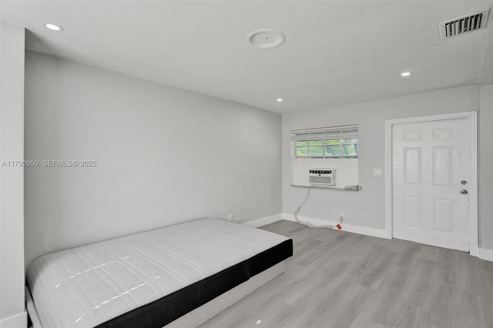 5657 Grant Street Hollywood, FL 33021 - Photo 21 of 59 a room with a bed and a view of room