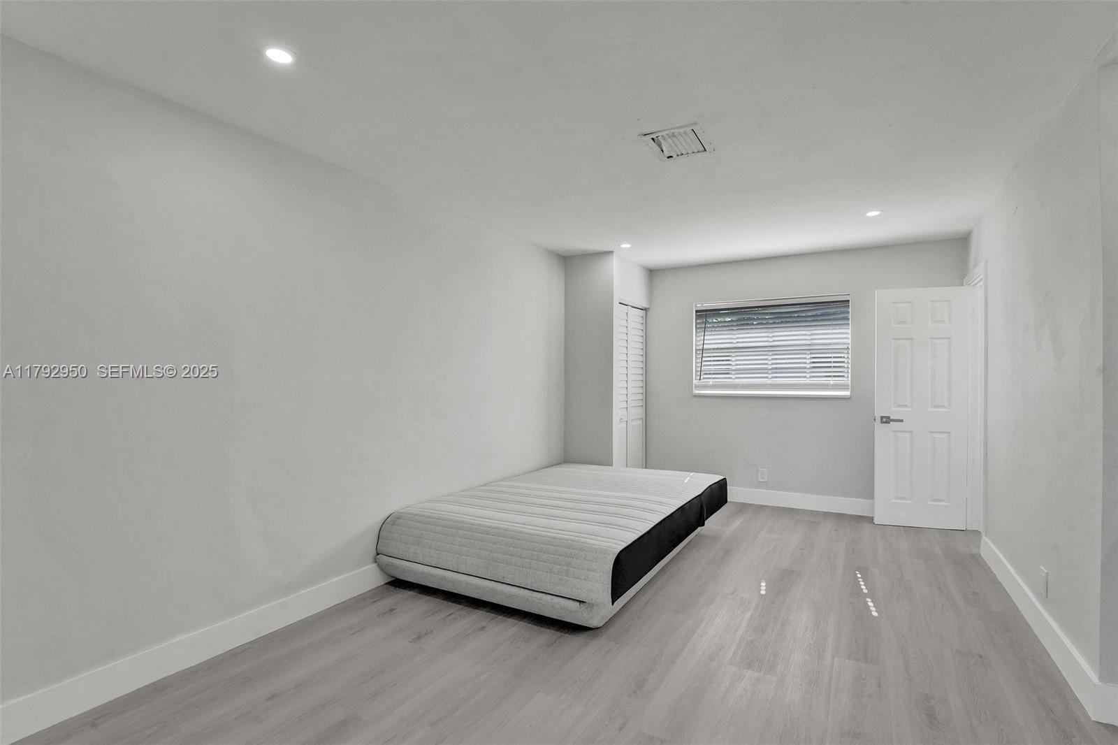 5657 Grant Street Hollywood, FL 33021 - Photo 23 of 59 a room with a bed and a window