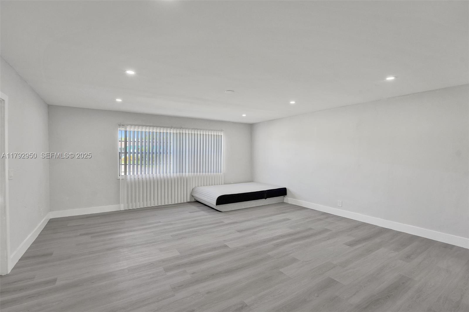 5657 Grant Street Hollywood, FL 33021 - Photo 33 of 59 a view of an empty room with wooden floor