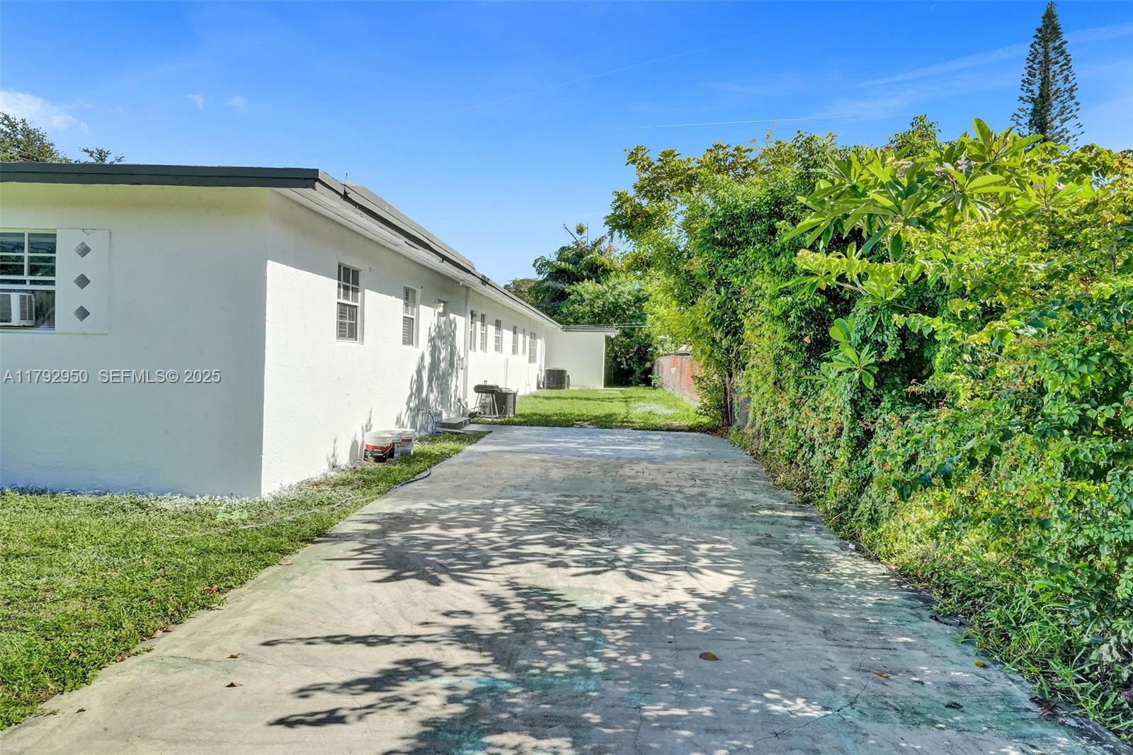 5657 Grant Street Hollywood, FL 33021 - Photo 52 of 59 a view of a back yard of the house
