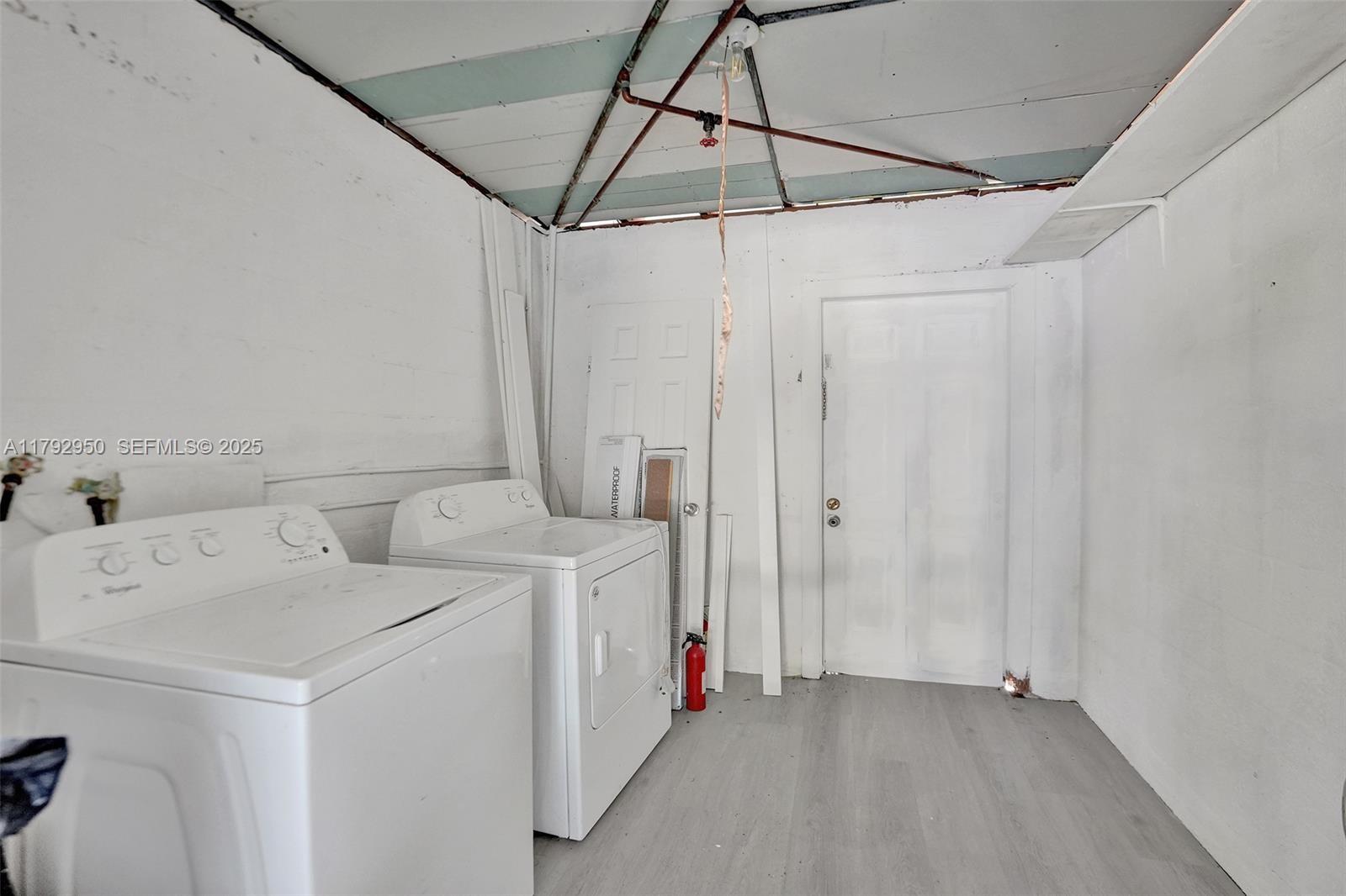 5657 Grant Street Hollywood, FL 33021 - Photo 59 of 59 a utility room with dryer and washer