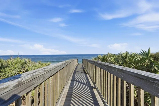 a kitchen with granite countertop cabinets stainless steel appliances and wooden floor