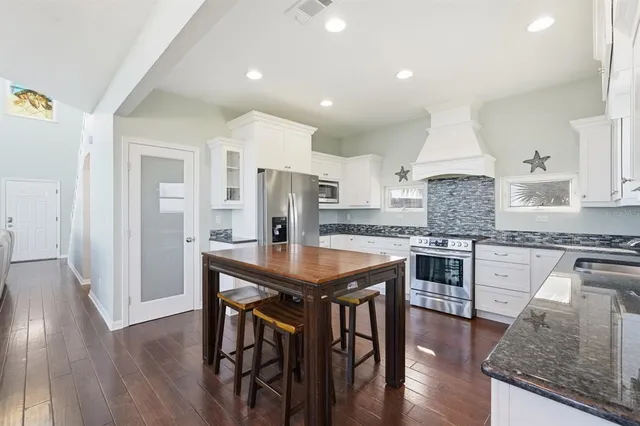 a bathroom with a glass shower door