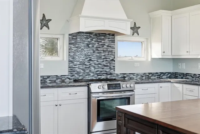 a living room with furniture a table and a potted plant