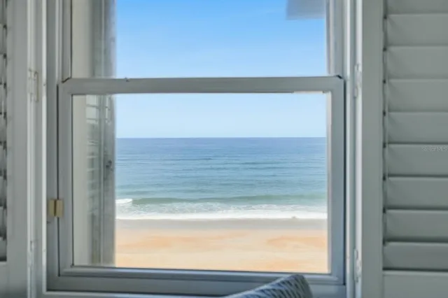 a view of a balcony with an ocean view