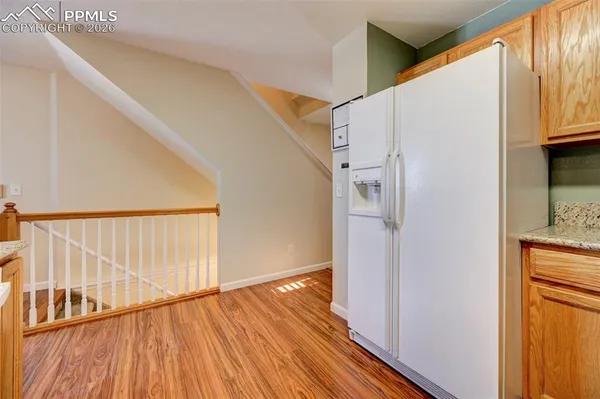 a view of front door and wooden floor
