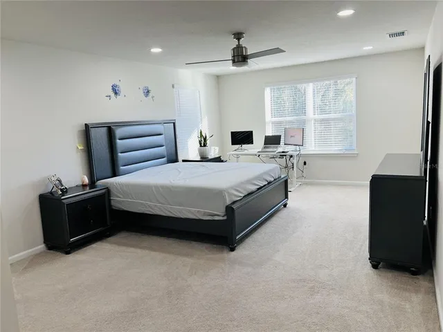 a bathroom with a sink a light fixture and a mirror