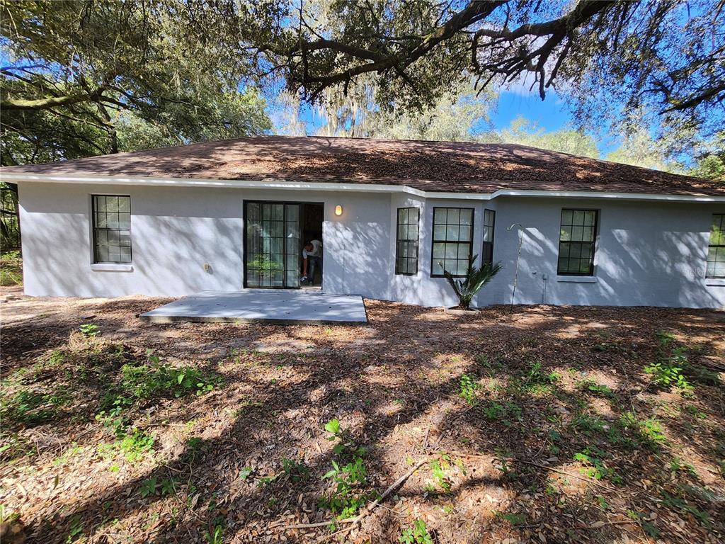 13767 Northeast 47th Avenue Anthony, FL 32617 - Photo 2 of 7 a view of a house with a yard