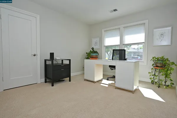 a view of workspace with furniture and a potted plant