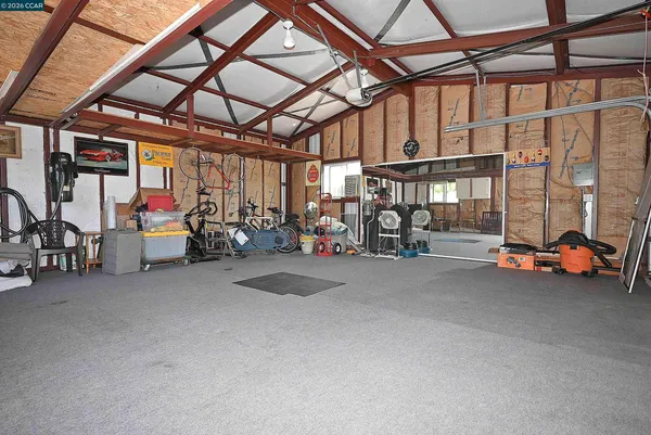 a front view of a house with potted plants