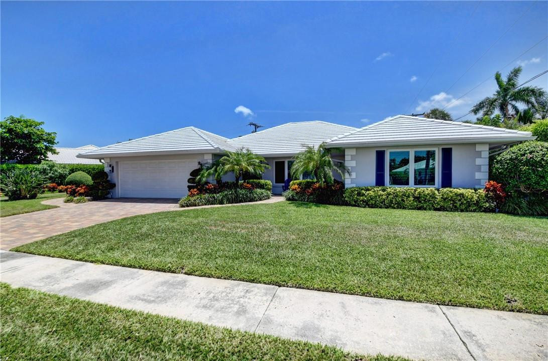 1163 Mulberry Way Boca Raton, FL 33486 - Photo 15 of 66 a front view of house with a garden