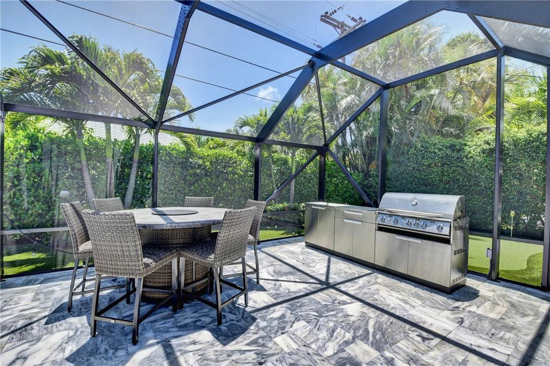 1163 Mulberry Way Boca Raton, FL 33486 - Photo 25 of 66 a view of outdoor sitting area with furniture and wooden floor