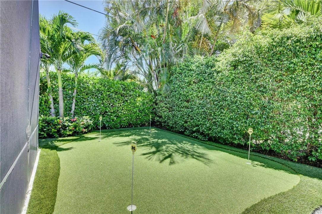 1163 Mulberry Way Boca Raton, FL 33486 - Photo 27 of 66 a view of a garden with a bench