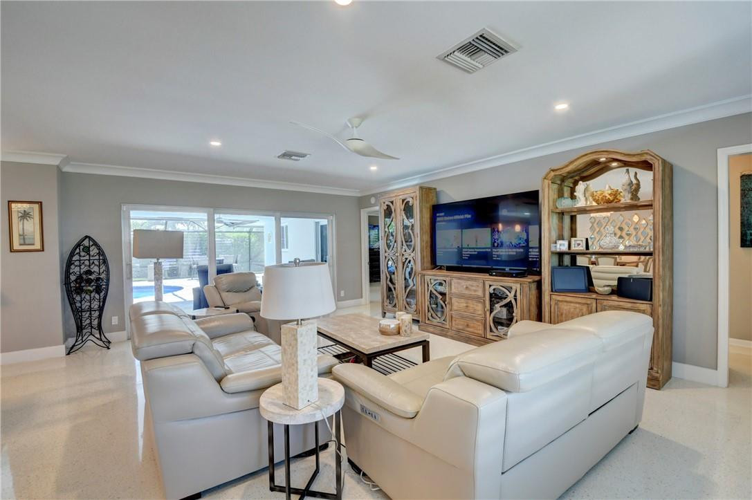 1163 Mulberry Way Boca Raton, FL 33486 - Photo 34 of 66 a living room with furniture and a flat screen tv