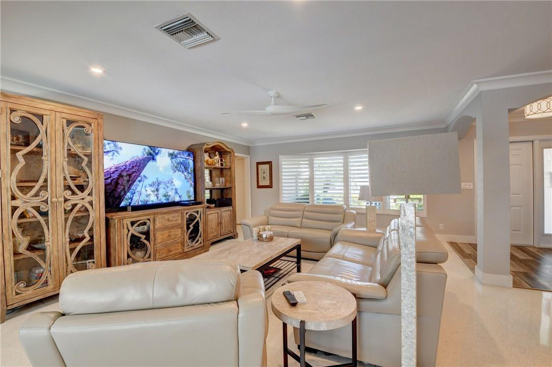 1163 Mulberry Way Boca Raton, FL 33486 - Photo 38 of 66 a living room with furniture and a flat screen tv