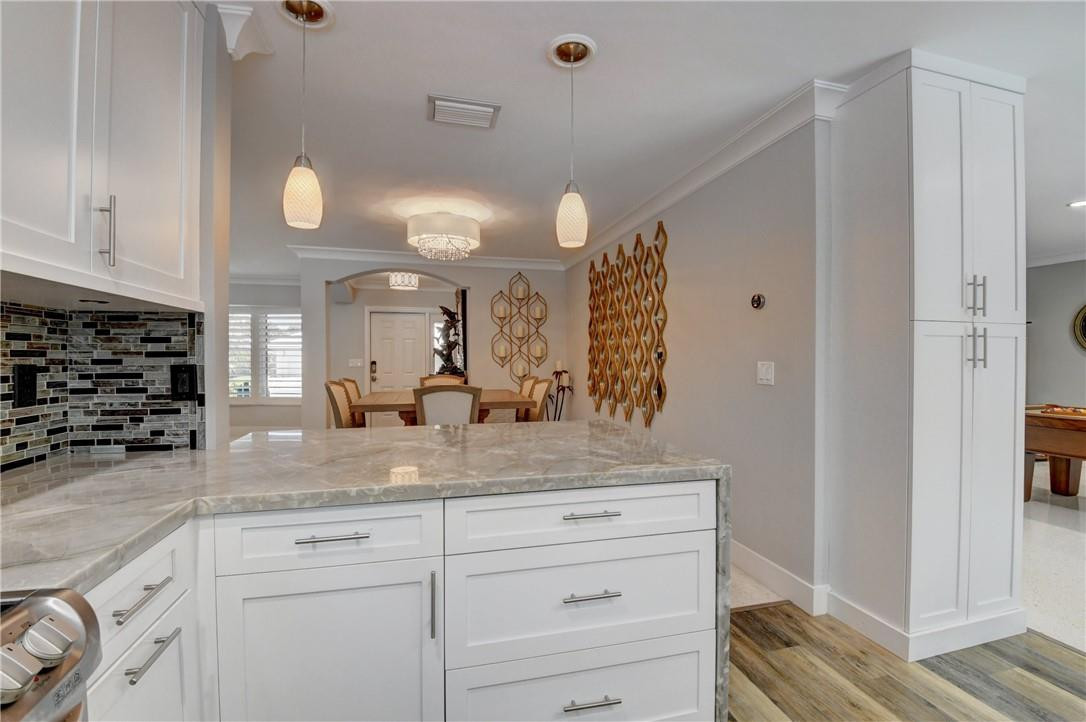 1163 Mulberry Way Boca Raton, FL 33486 - Photo 47 of 66 a view of a granite countertop cabinets