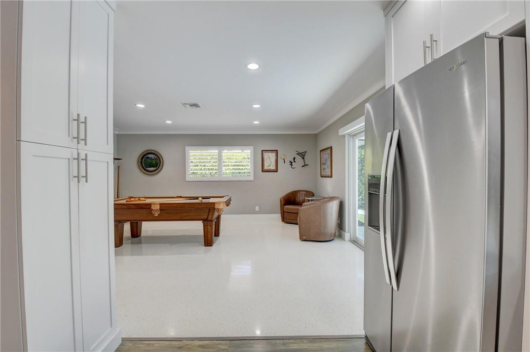 1163 Mulberry Way Boca Raton, FL 33486 - Photo 48 of 66 a kitchen with stainless steel appliances refrigerator and window