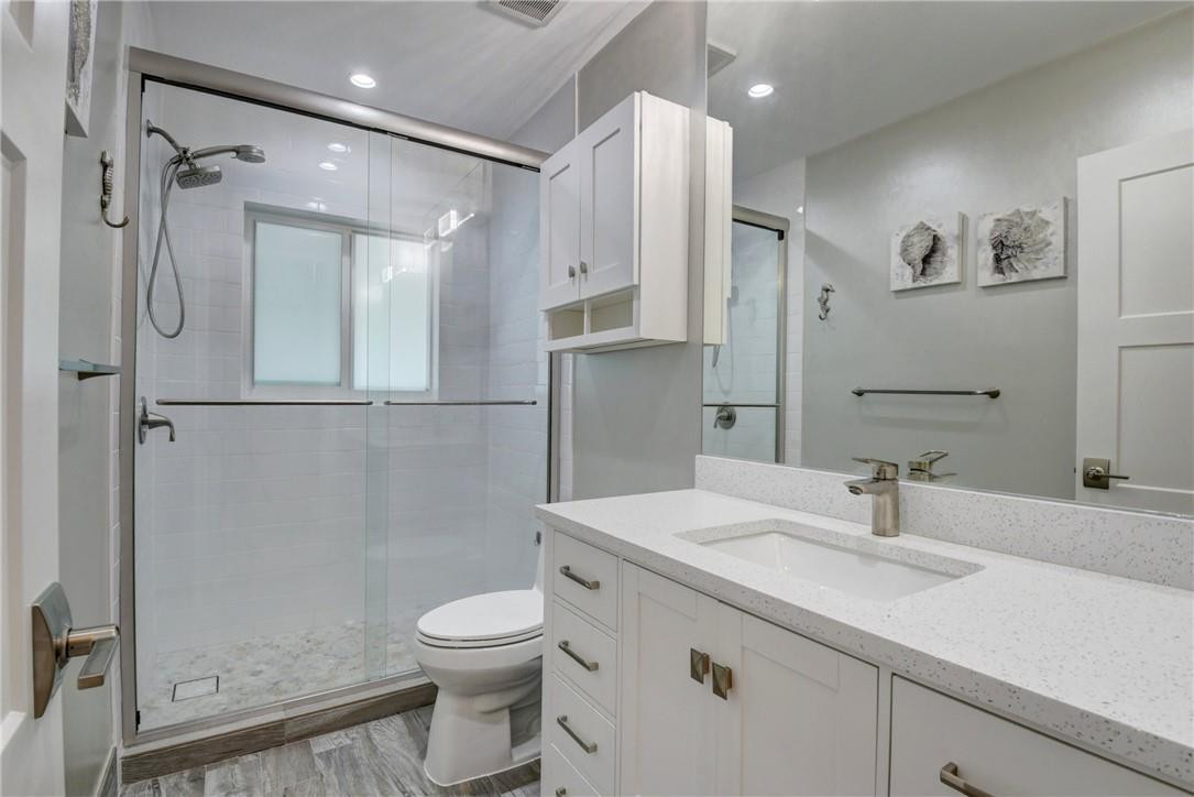 1163 Mulberry Way Boca Raton, FL 33486 - Photo 63 of 66 a bathroom with a sink a toilet and shower
