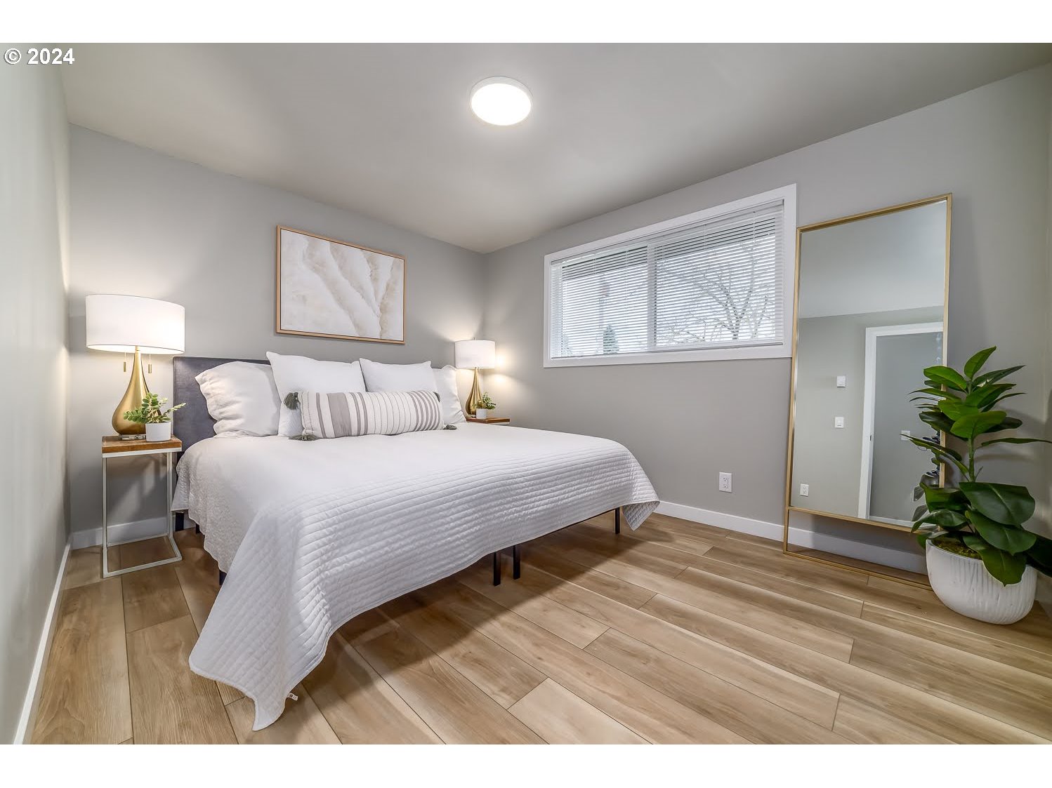 375 Heritage Avenue Eugene, OR 97404 - Photo 14 of 32 a bedroom with a bed and a potted plant