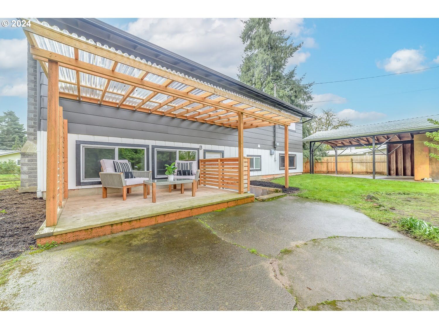 375 Heritage Avenue Eugene, OR 97404 - Photo 31 of 32 a view of a house with a backyard porch and sitting area