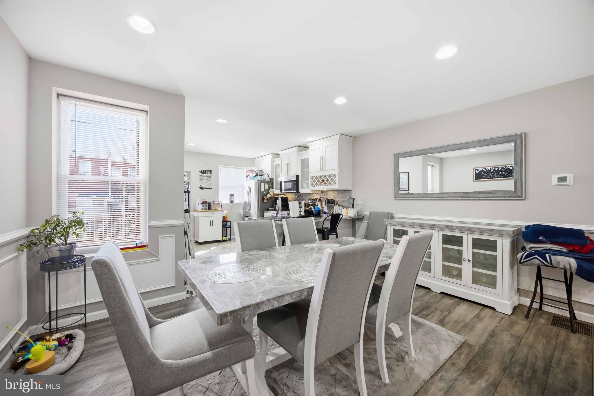 7167 Georgian Road Philadelphia, PA 19138 - Photo 13 of 34 a view of a dining room with furniture window and wooden floor