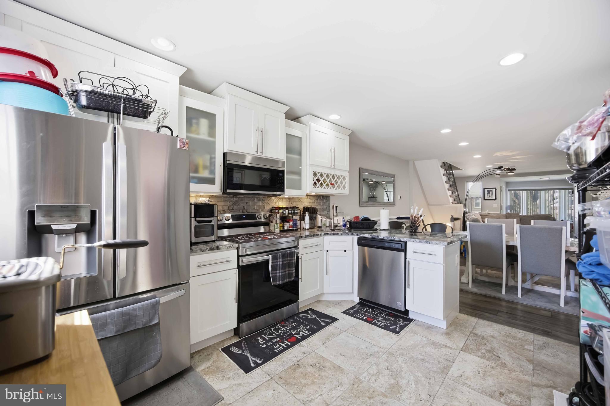 7167 Georgian Road Philadelphia, PA 19138 - Photo 15 of 34 a kitchen with a sink stainless steel appliances and cabinets