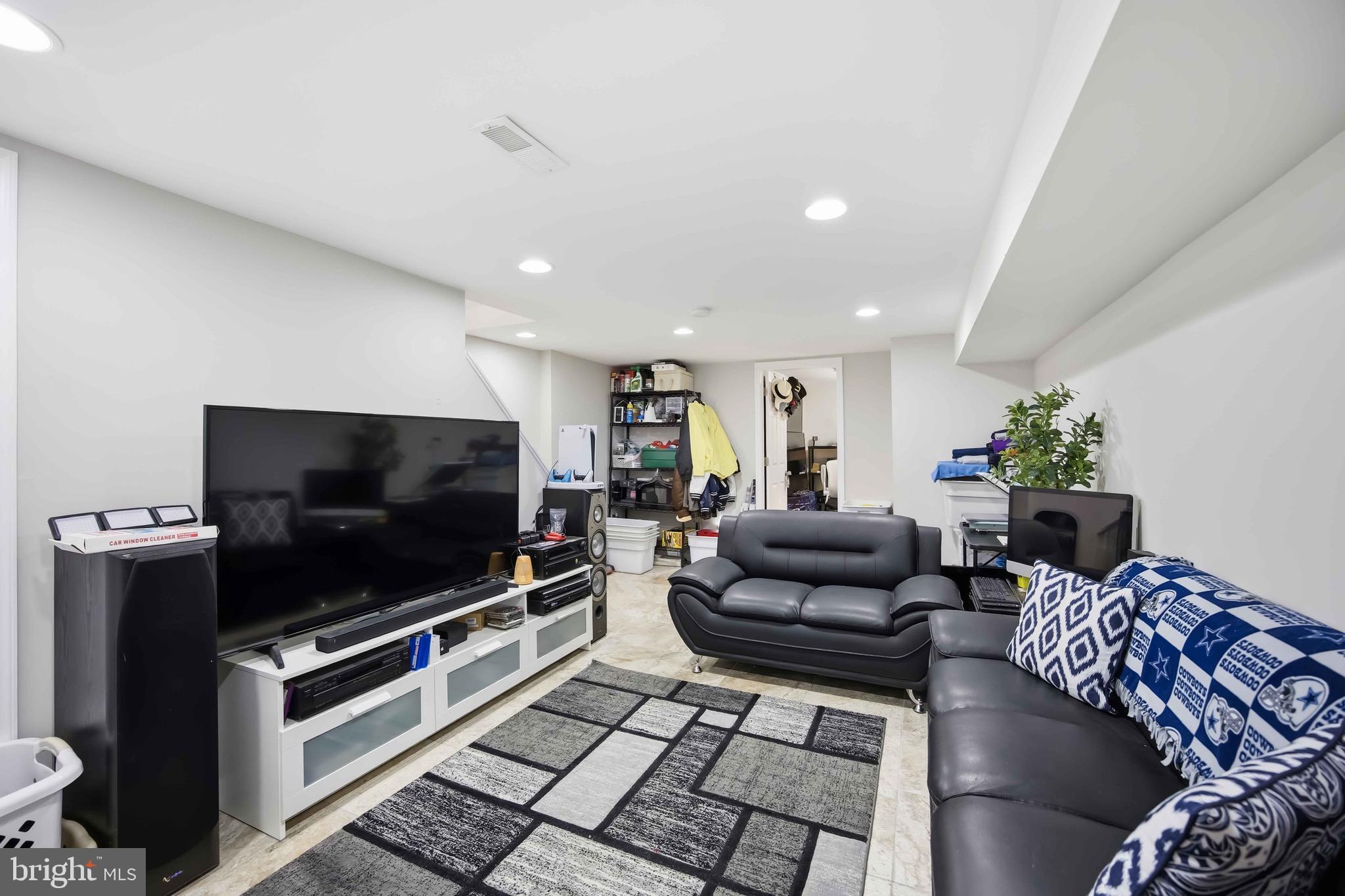 7167 Georgian Road Philadelphia, PA 19138 - Photo 19 of 34 a living room with furniture and a flat screen tv