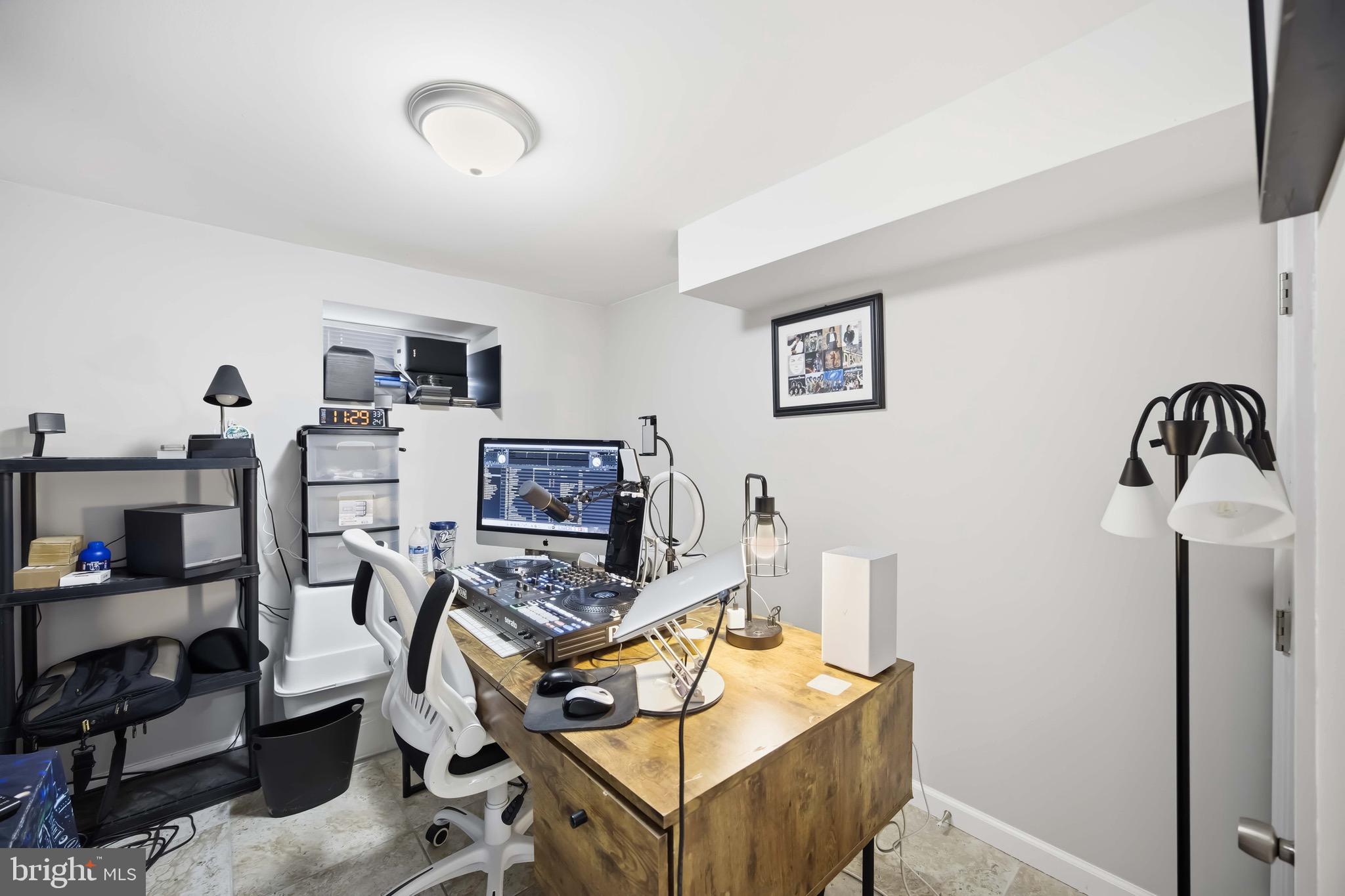 7167 Georgian Road Philadelphia, PA 19138 - Photo 20 of 34 a view of a workspace with furniture and storage