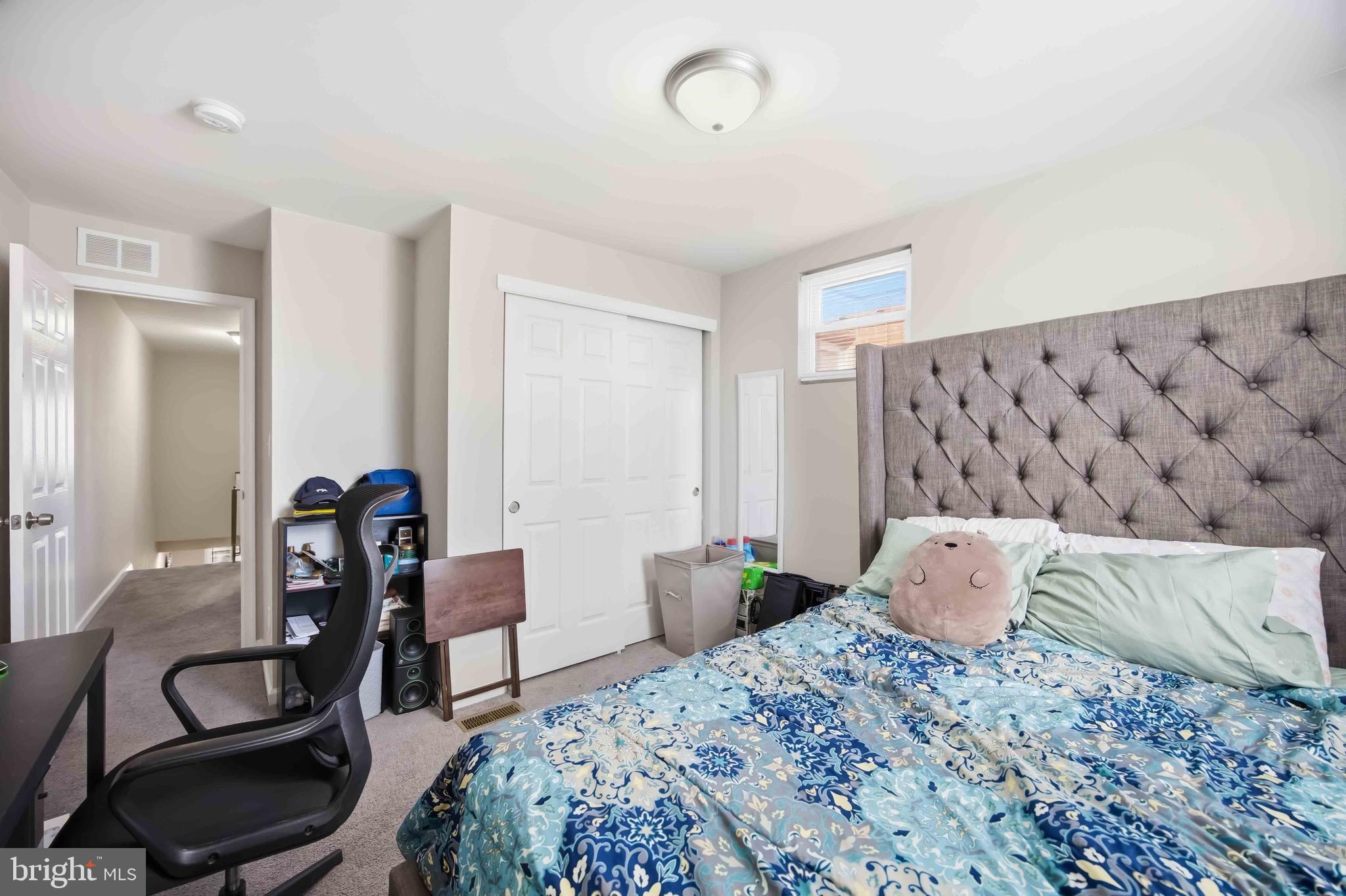 7167 Georgian Road Philadelphia, PA 19138 - Photo 24 of 34 a bedroom with a bed and a couch