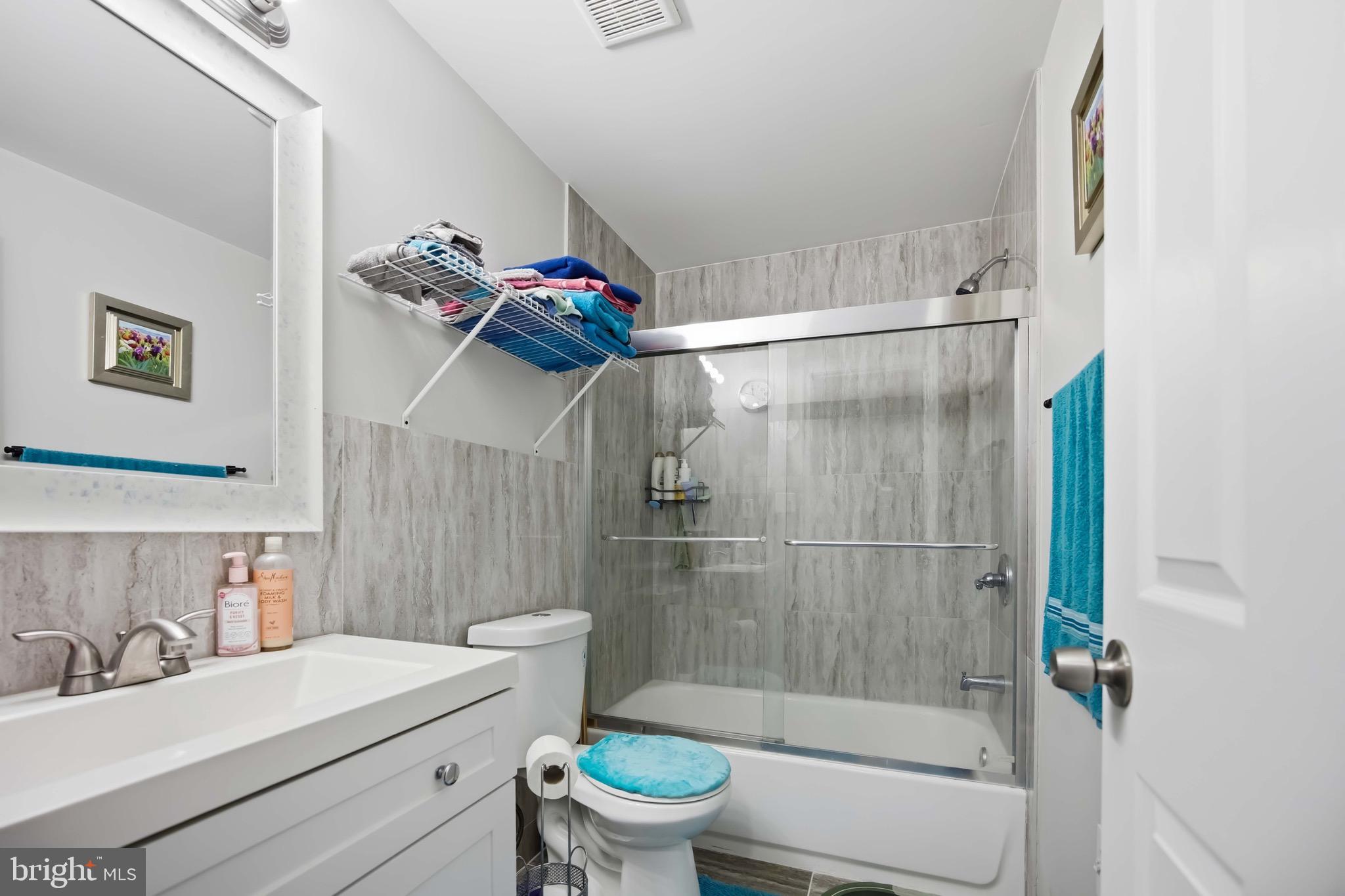 7167 Georgian Road Philadelphia, PA 19138 - Photo 26 of 34 a bathroom with a sink toilet and shower