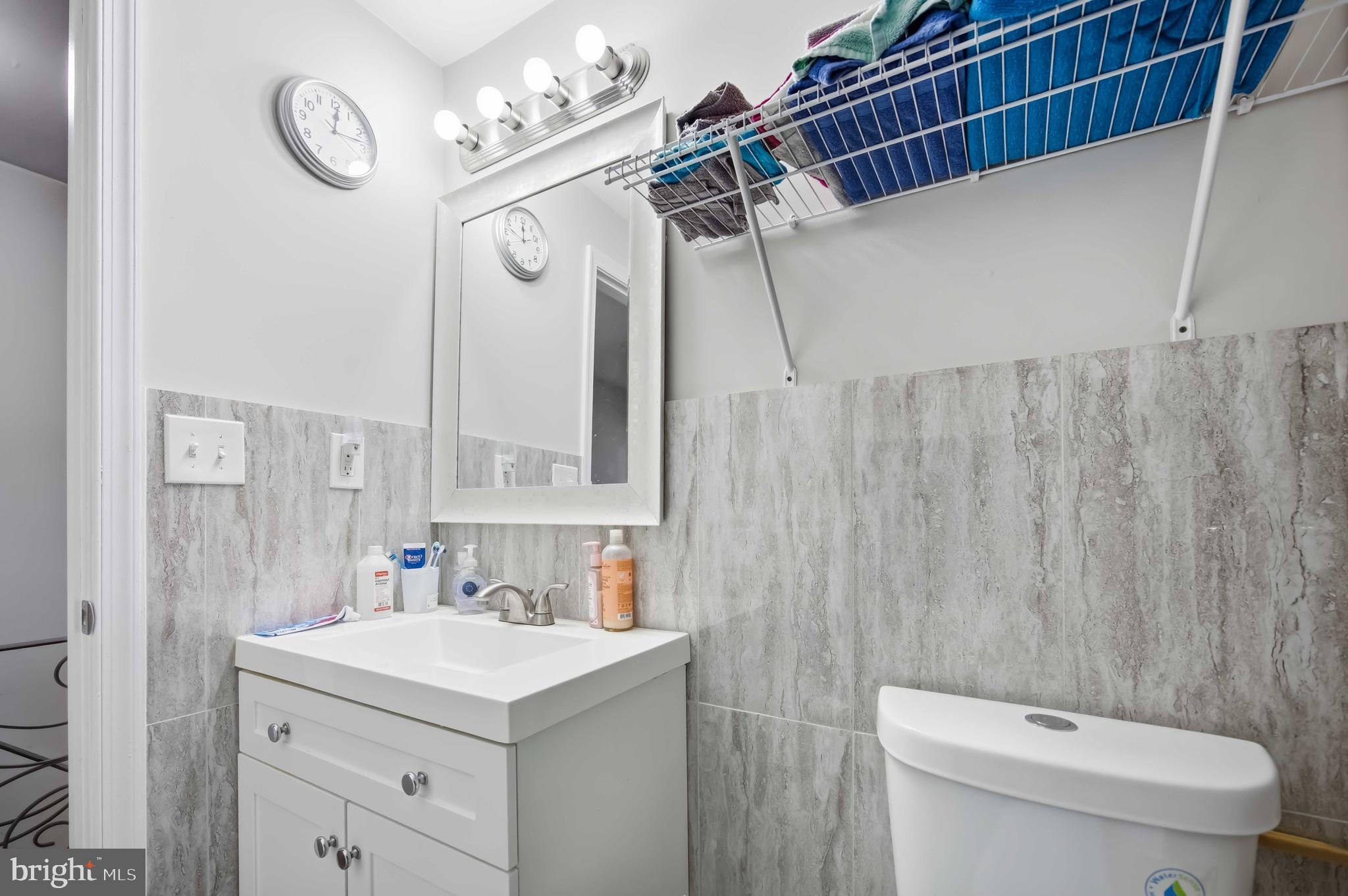 7167 Georgian Road Philadelphia, PA 19138 - Photo 27 of 34 a bathroom with a sink a toilet and a mirror