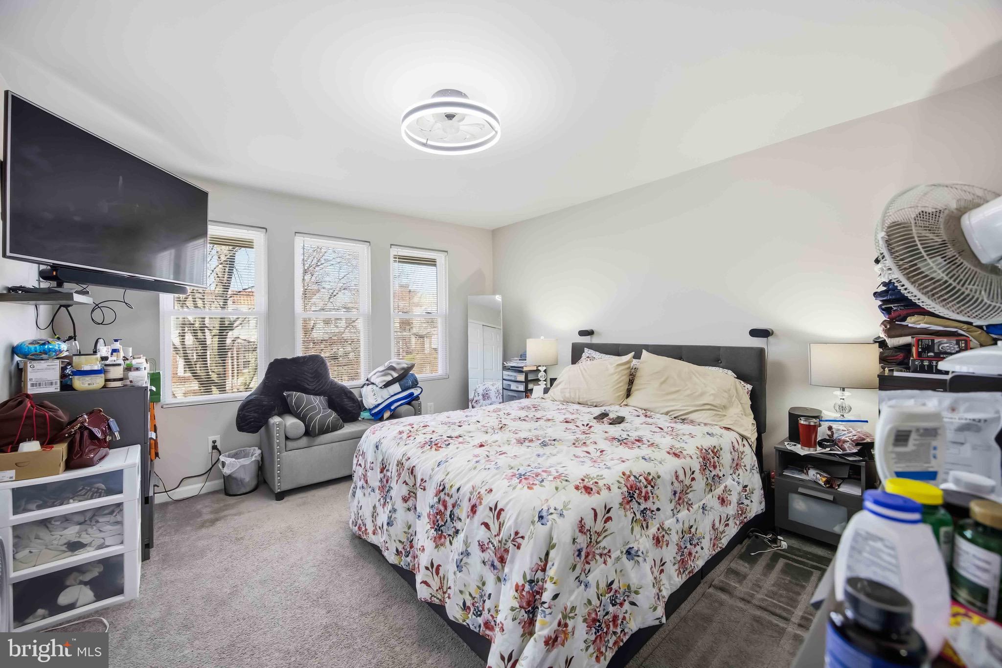 7167 Georgian Road Philadelphia, PA 19138 - Photo 28 of 34 a bed room with a bed a flat screen tv and a couch