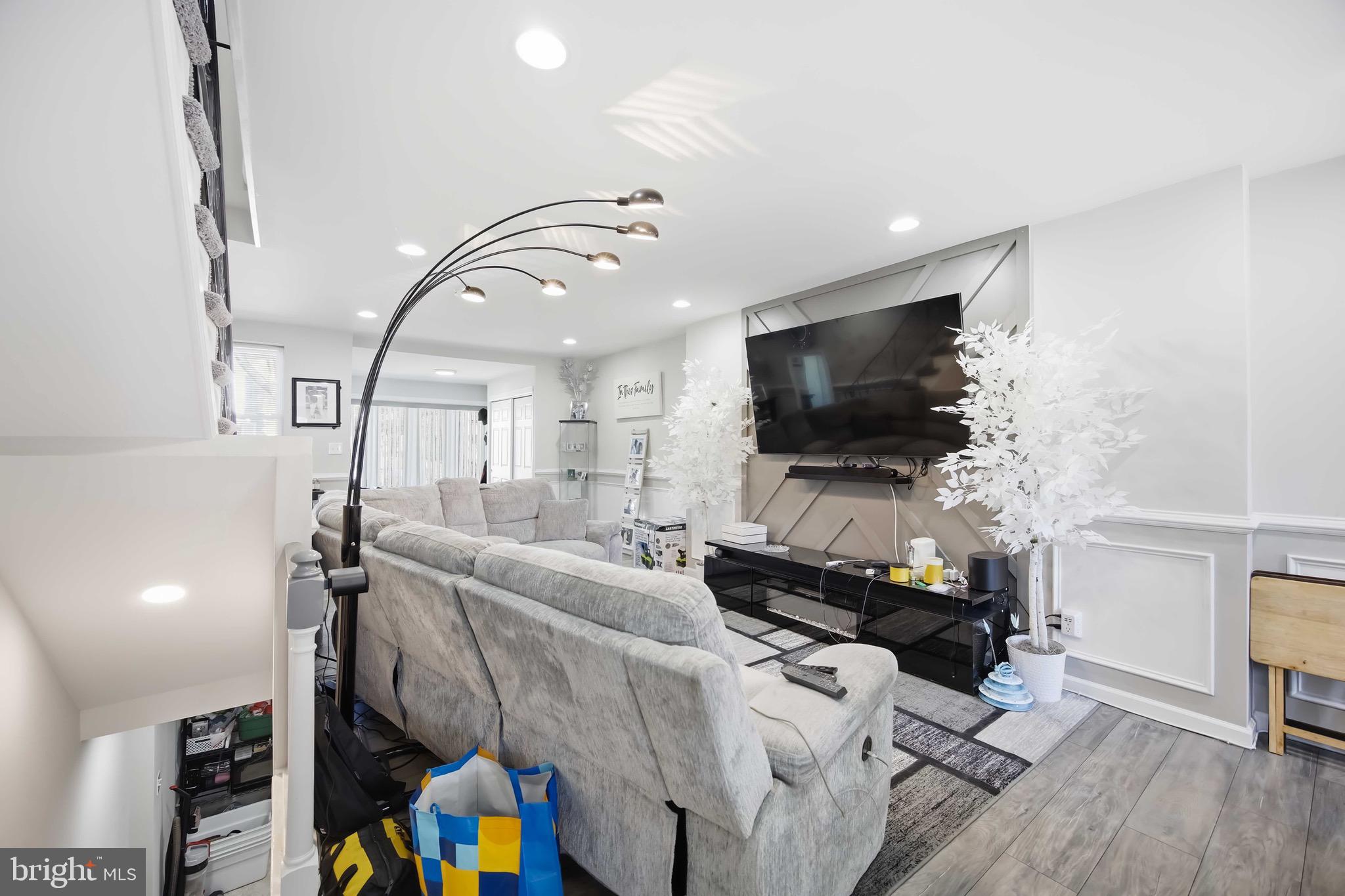 7167 Georgian Road Philadelphia, PA 19138 - Photo 9 of 34 a living room with furniture and a flat screen tv