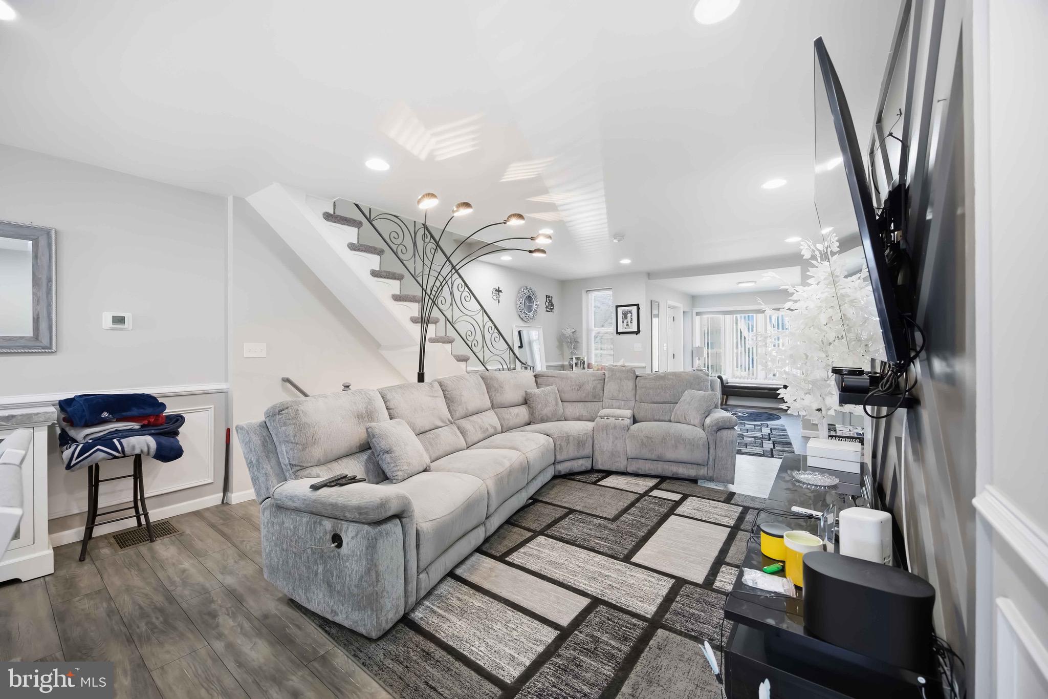 7167 Georgian Road Philadelphia, PA 19138 - Photo 10 of 34 a living room with furniture and a chandelier