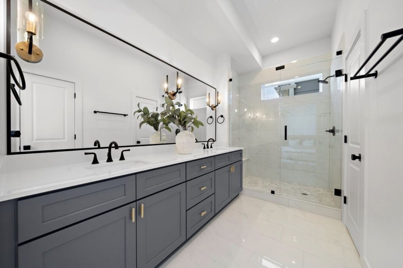 835 Elkhart Street, Unit B Houston, TX 77091 - Photo 11 of 14 a bathroom with a double vanity sink mirror and shower