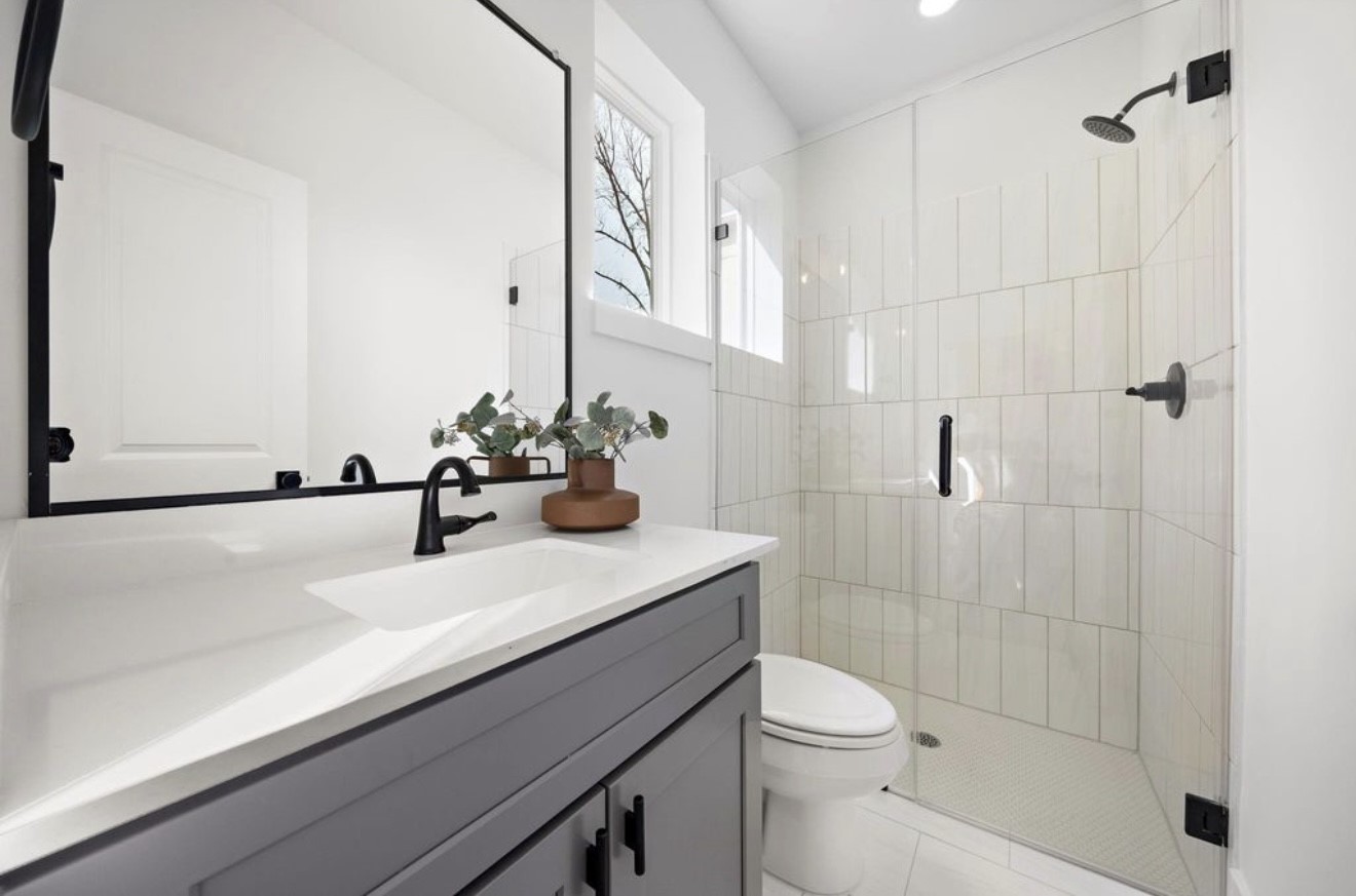 835 Elkhart Street, Unit B Houston, TX 77091 - Photo 14 of 14 a bathroom with a sink a toilet and shower