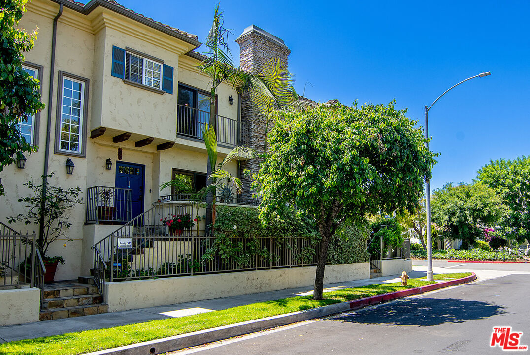 11622 Valley Spring Lane, Unit 2 Studio City, CA 91604 - Photo 1 of 1 a view of a house with swimming pool and a yard