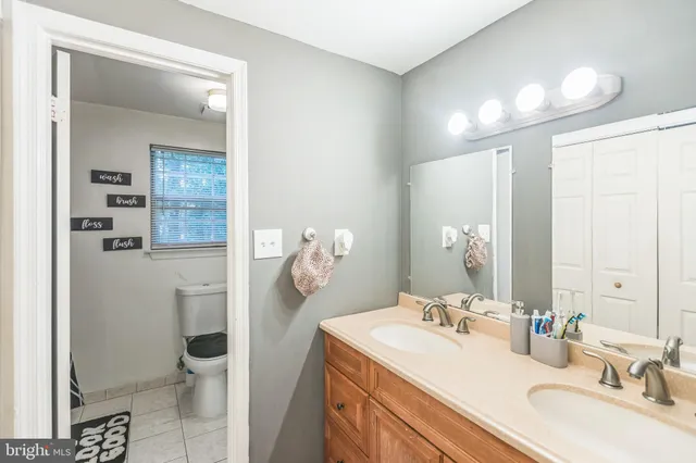 a bathroom with a sink and mirror