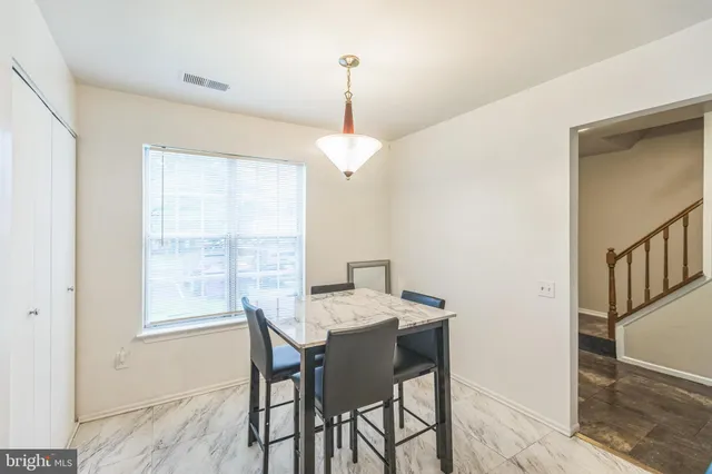 a dining room with furniture window wooden floor