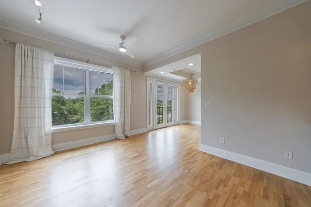 wooden floor in an empty room with a window