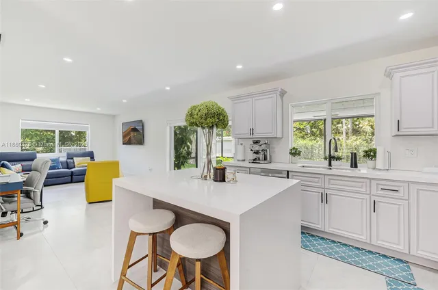 a kitchen with sink and window