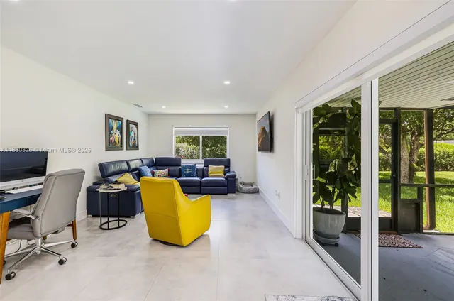 a living room with furniture and a window