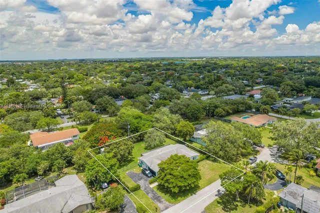 an aerial view of a house with a garden