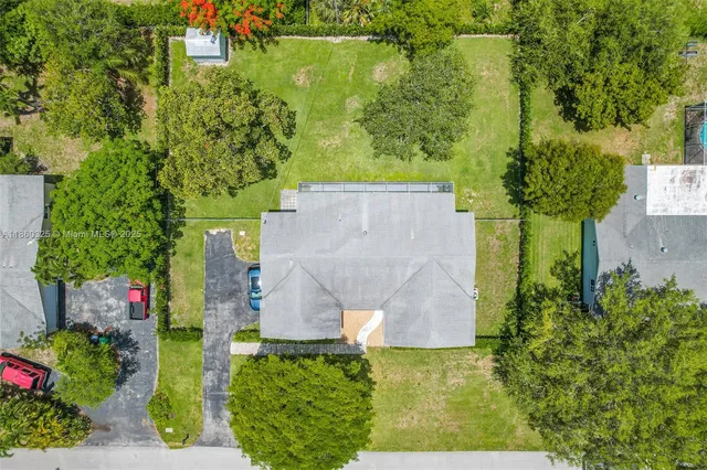 an aerial view of a house with a garden
