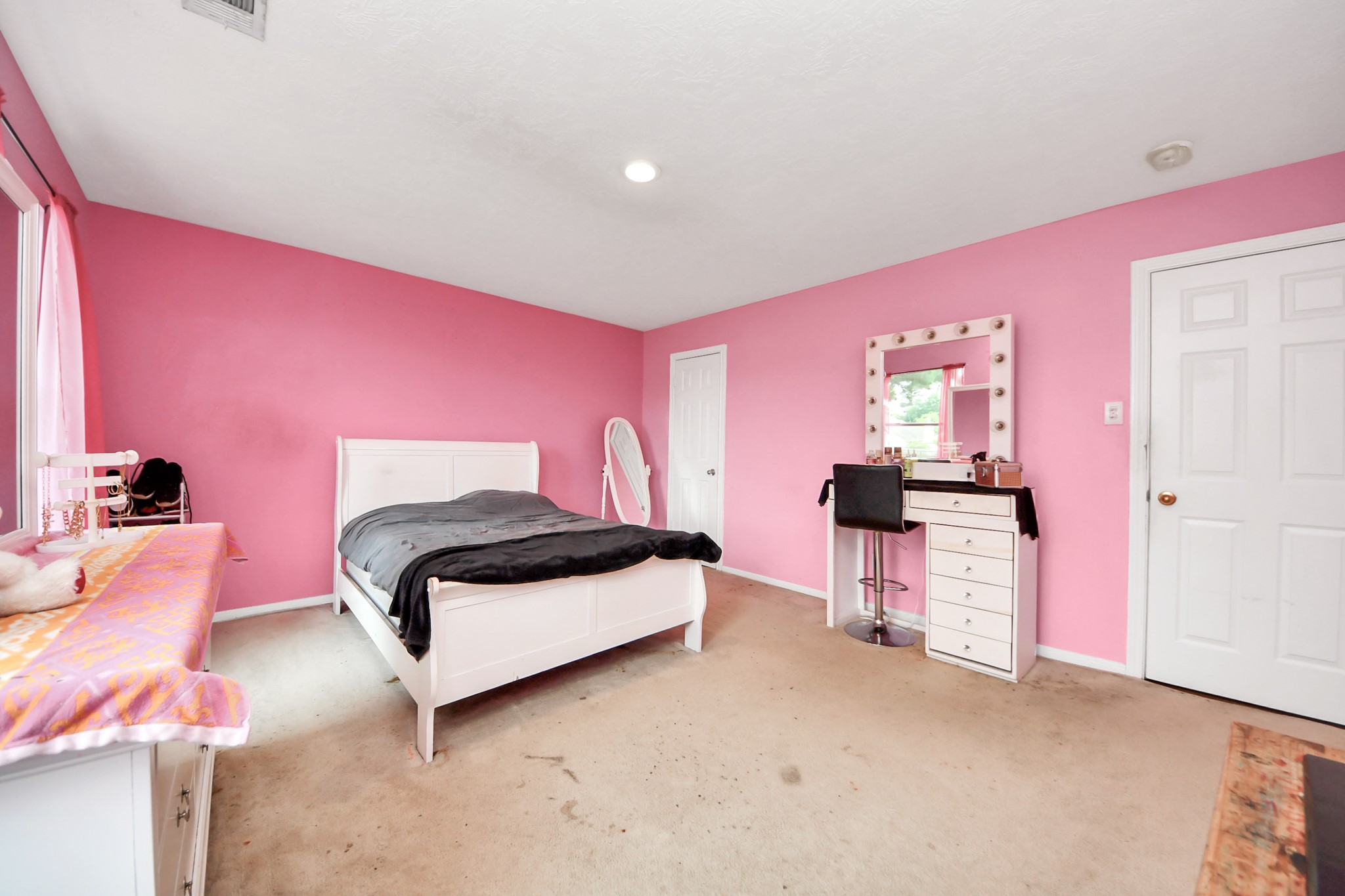 23814 Spring Dane Drive Spring, TX 77373 - Photo 39 of 41 a bedroom with a bed and a table