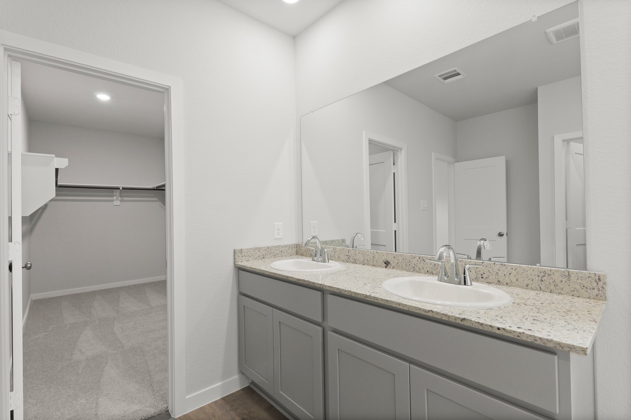 529 Shoreview Drive Conroe, TX 77303 - Photo 15 of 34 a bathroom with a granite countertop sink and a mirror