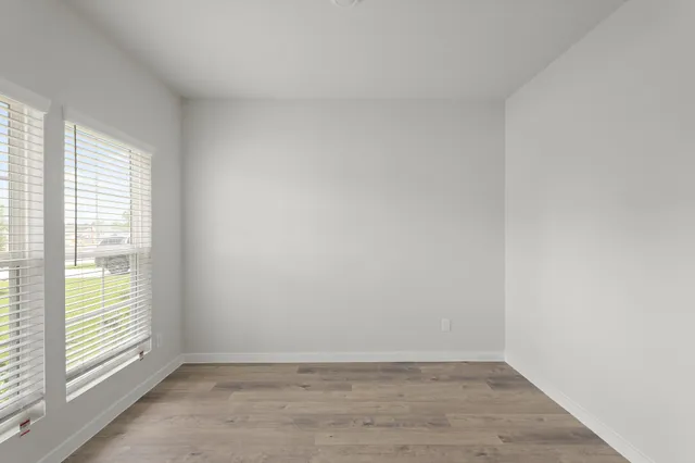 a view of an empty room and window