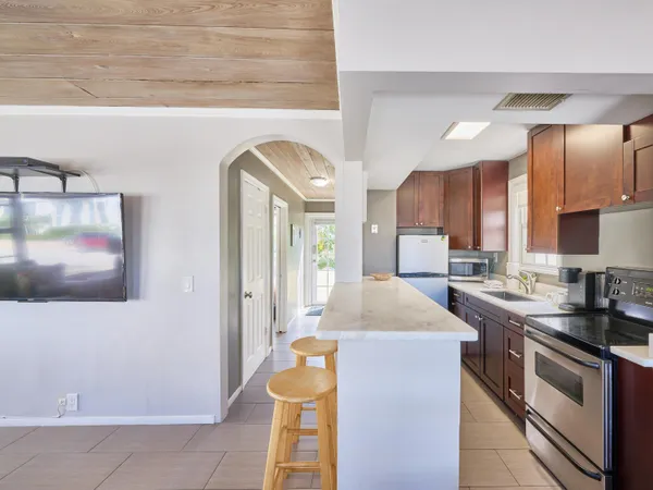 a kitchen with stainless steel appliances granite countertop a sink and cabinets